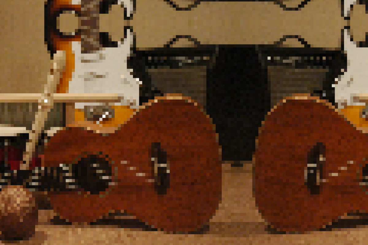 a very pixelated image of an acoustig guitar, electric guitar, recorder, maracas, bongos, and a washboard, mirrored on the side about 80% of the way through and at the top about 90% of the way through